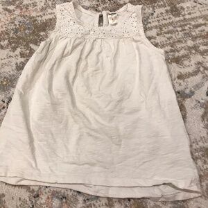 White sleeveless top